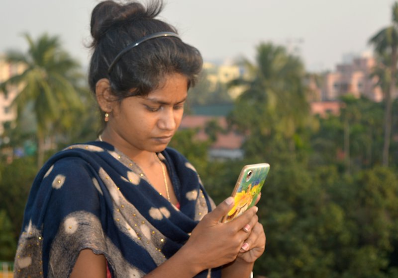 A young woman checking her phone